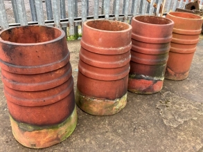 Terracotta ribbed chimney pots