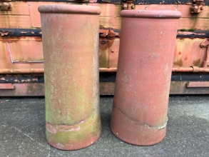 A pair of terracotta chimney pots