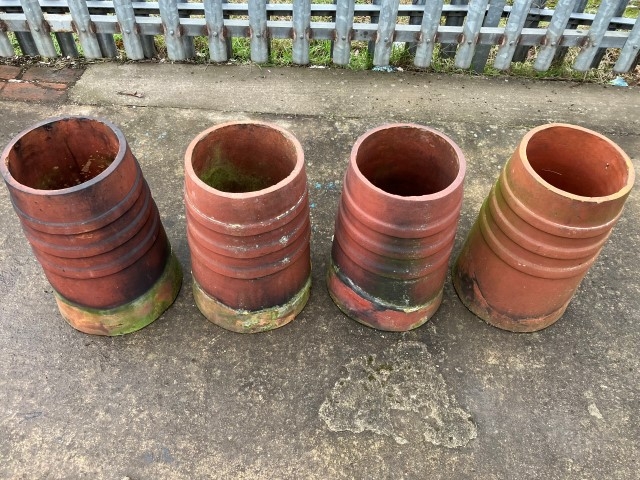 Terracotta ribbed chimney pots