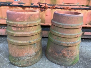 Two ribbed terracotta chimney pots