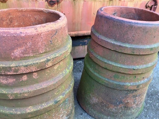Two ribbed terracotta chimney pots