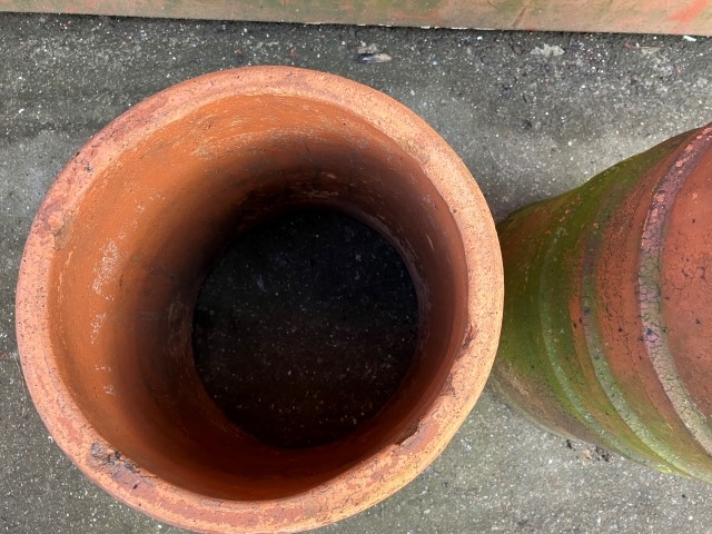 Two ribbed terracotta chimney pots