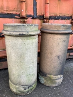 A pair of buff cylindrical pots