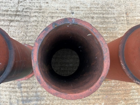 Trio of terracotta chimney pots